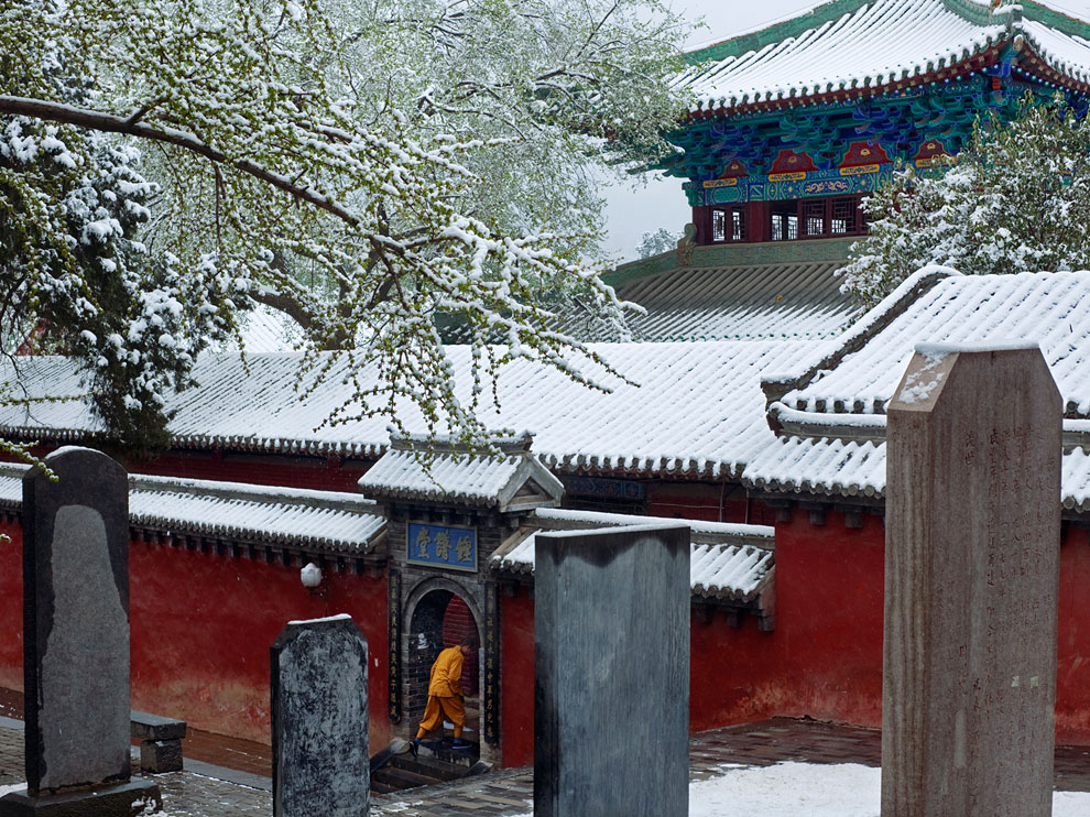 Picture of a monk seeking shelter from the snow in a temple in China